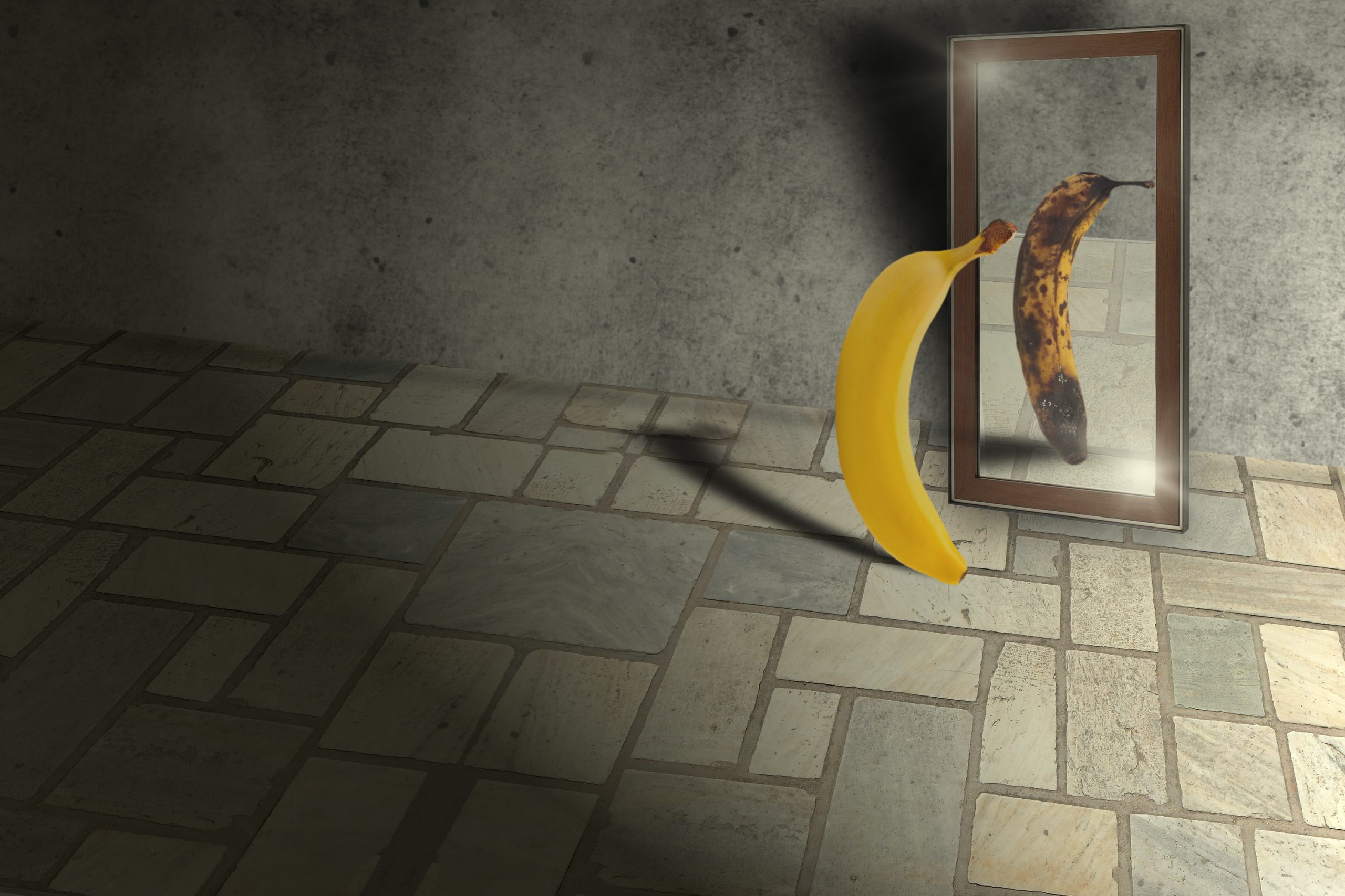Decorative image of a yellow banana looking in a mirror and seeing a brown, spotted, almost rotten banana