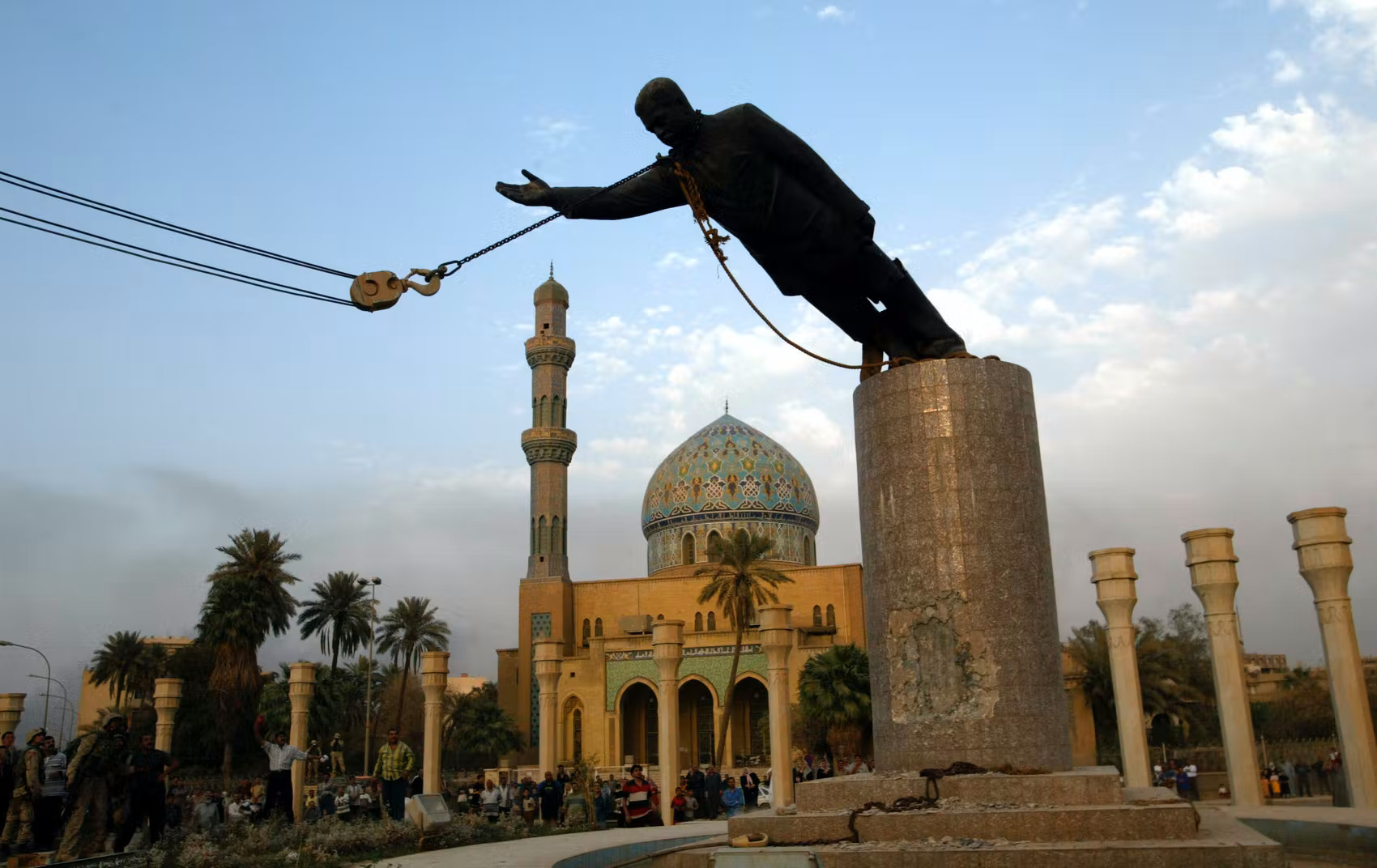 Photograph of Toppling of Statue of Saddam Hussein, 2003 (Firdos Square, Baghdad). Photo: Public Domain.