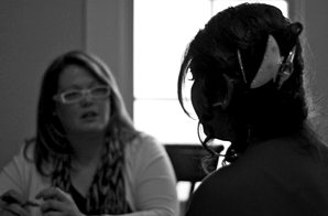 Woman interviewing a student.